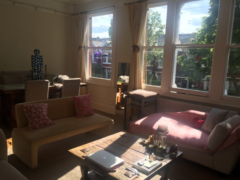 Photo 1: The living room with lots of natural light