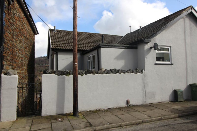 Photo 1: House from front