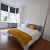 Large ground floor room with laminate flooring Main Photo