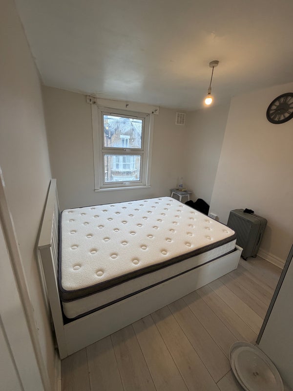 Photo 1: Comfortable double room with king-size ottoman bed and good natural light.