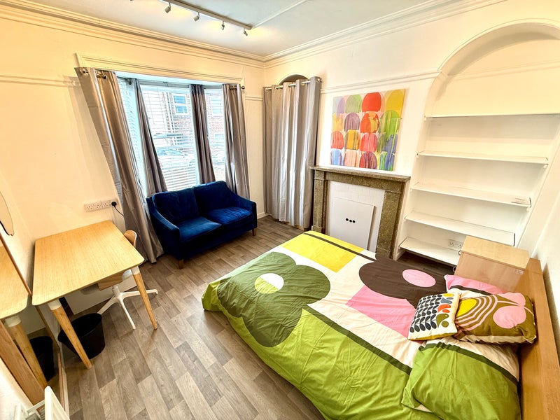 Photo 1: Room 1 really good size room with very comfy sofa! 