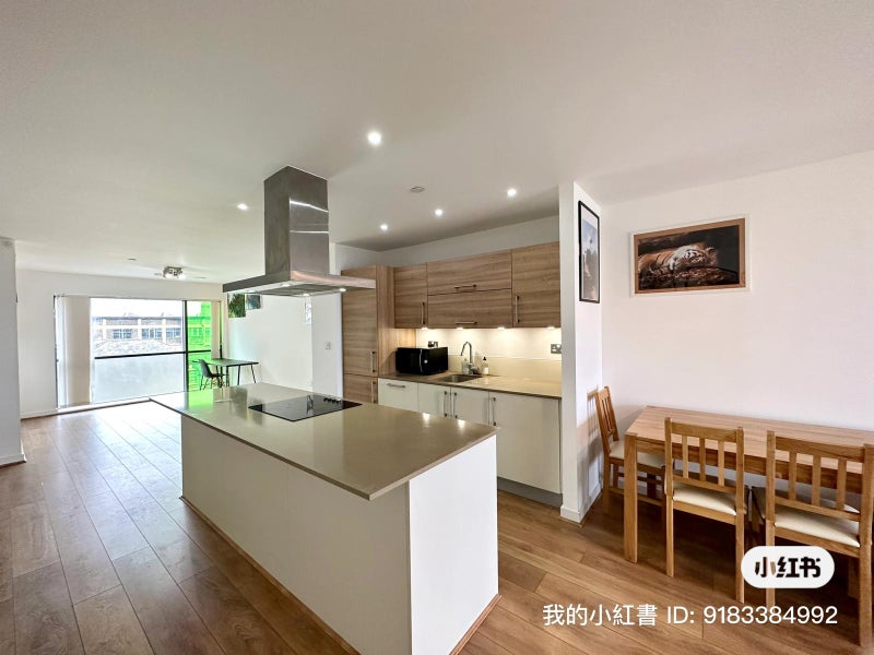 Photo 1: Shared kitchen and living room