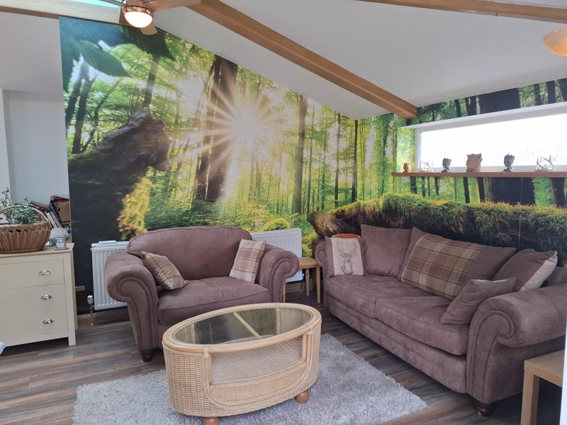 Photo 1: Comfortable lounge looking out of double patio doors to patio seating area