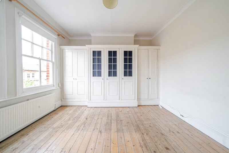Photo 1: Empty large bedroom with wardrobes and two windows