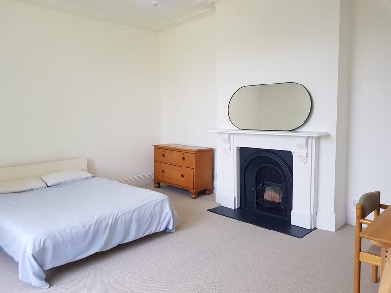 Photo 1: Bedroom showing sleeping area