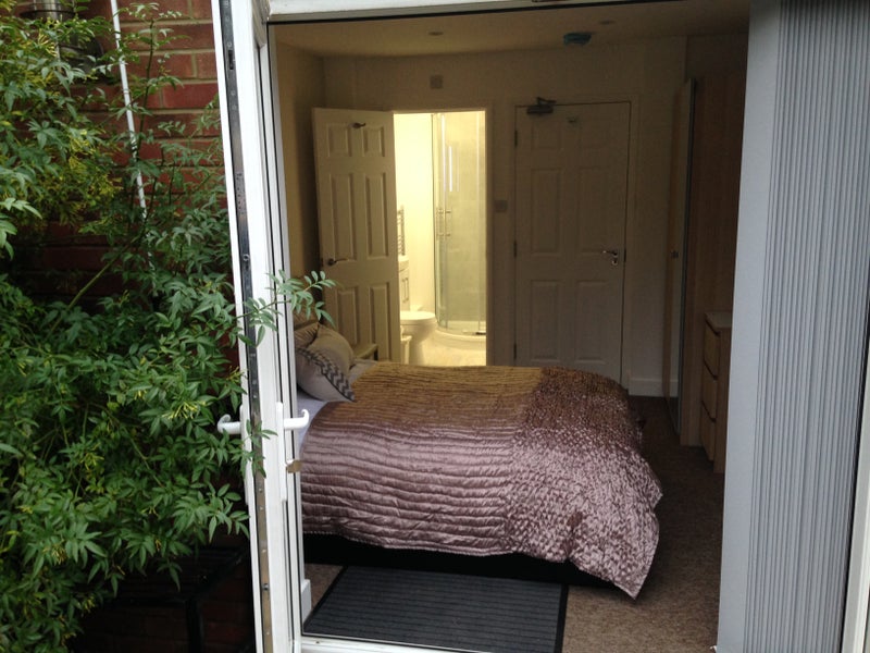 Photo 1: Lovely ensuite with doors to the garden 