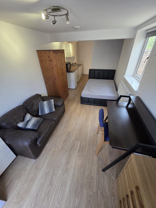 Photo 1: GF - Spacious Studio Apartment