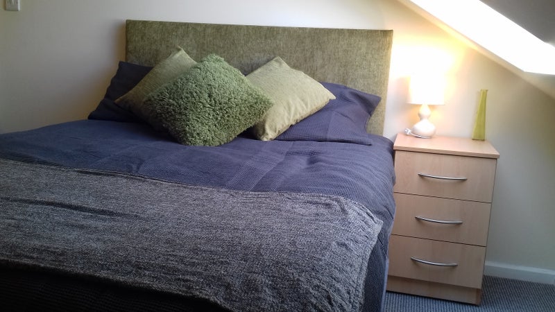 Photo 1: Bedroom with bed, side table, lamp