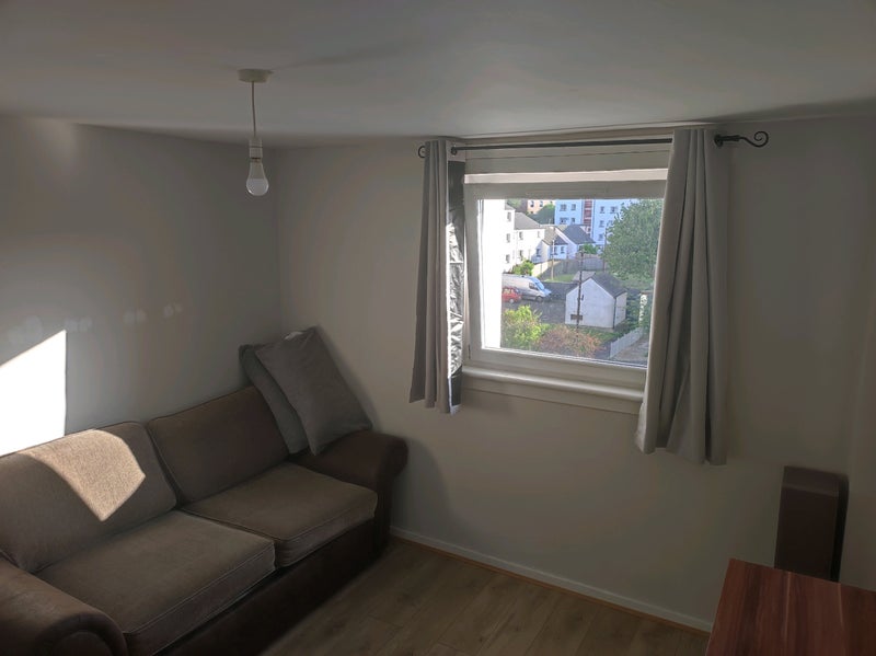 Photo 1: Window with blackout curtains