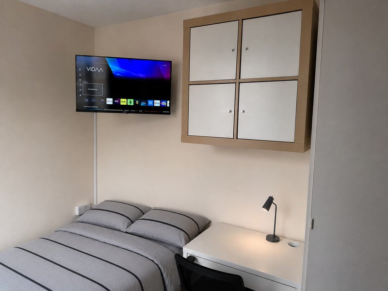 Photo 1: Wall-mounted TV Bedroom 2