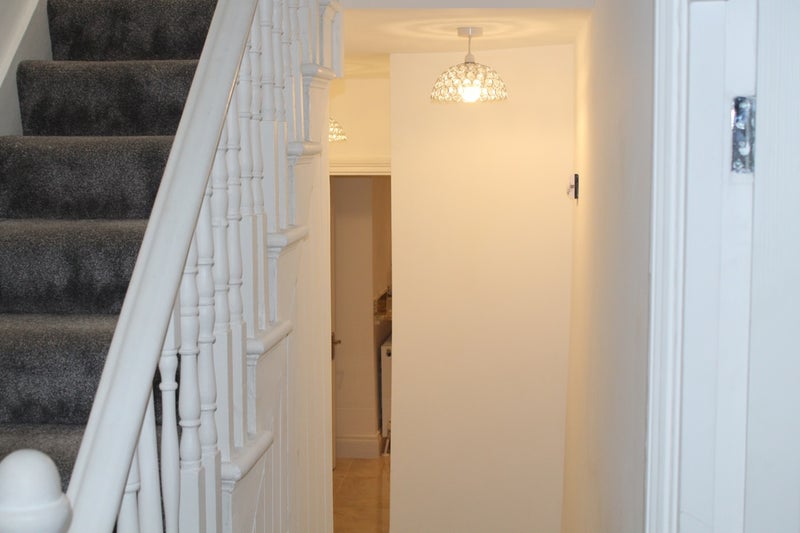 Photo 1: Stairs / hallway