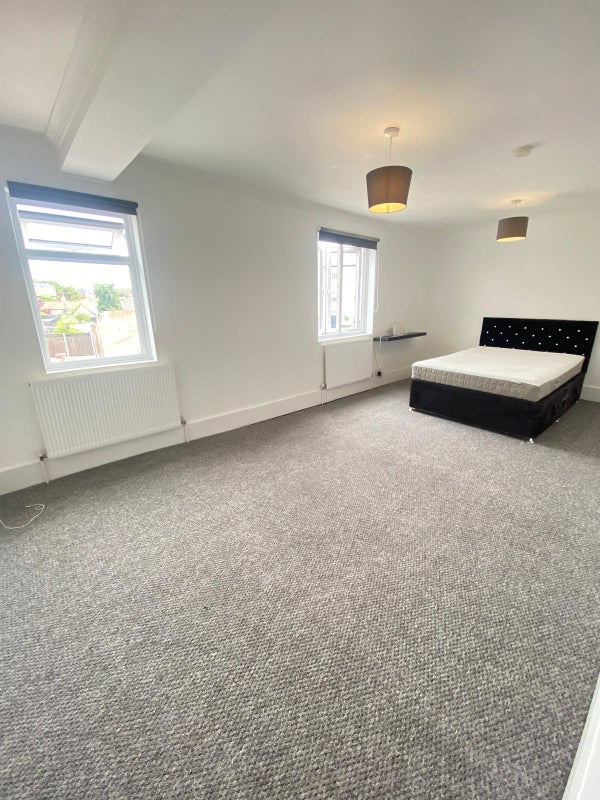 Photo 1: Bedroom with shared communal with one other person