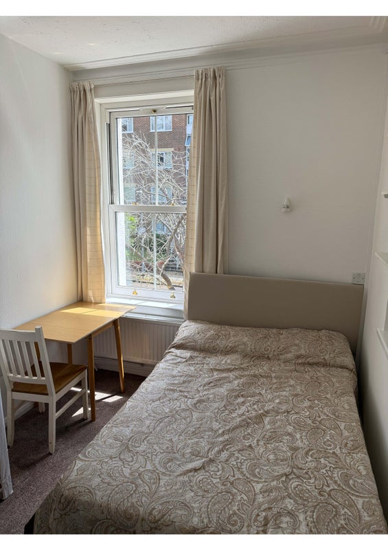 Photo 1: Bed and table