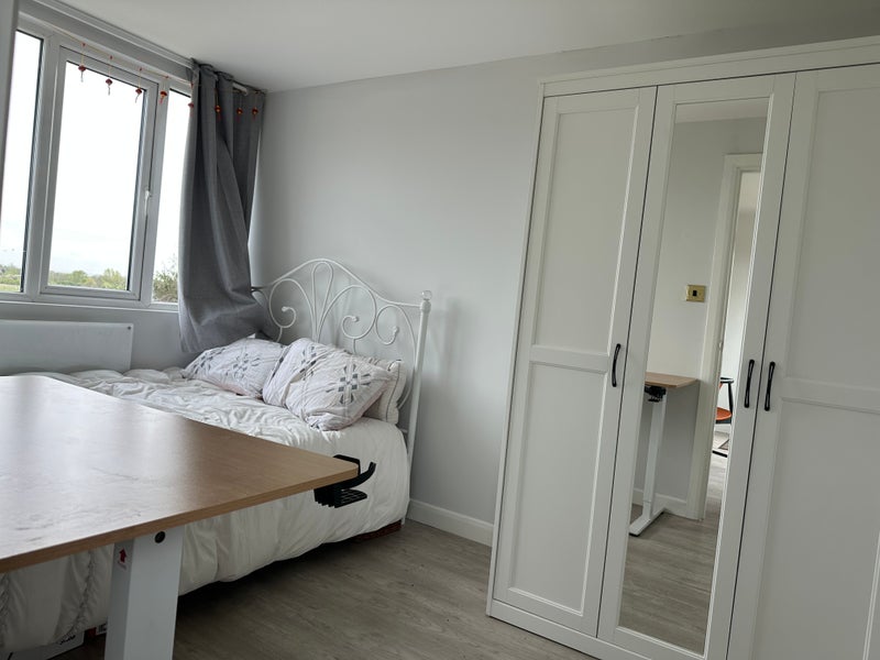 Photo 1: Bedroom with double bed and double wardrobe 