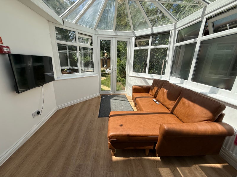 Photo 1: TV & Sofa Area