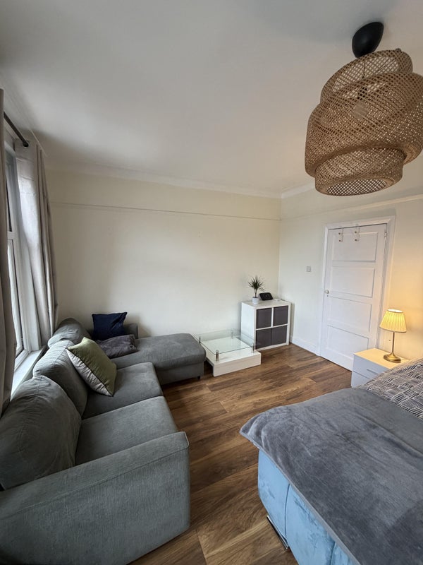 Photo 1: L Shaped sofa and coffee table
