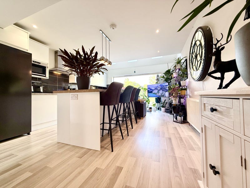 Photo 1: Kitchen & Shared living area
