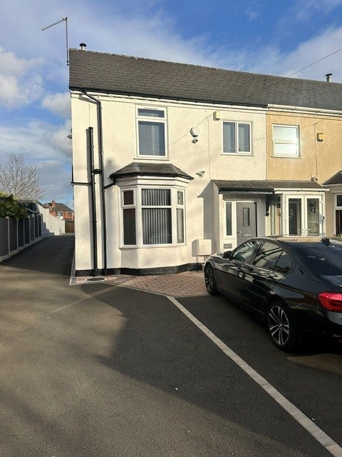 Photo 1: Front view of property and car parking