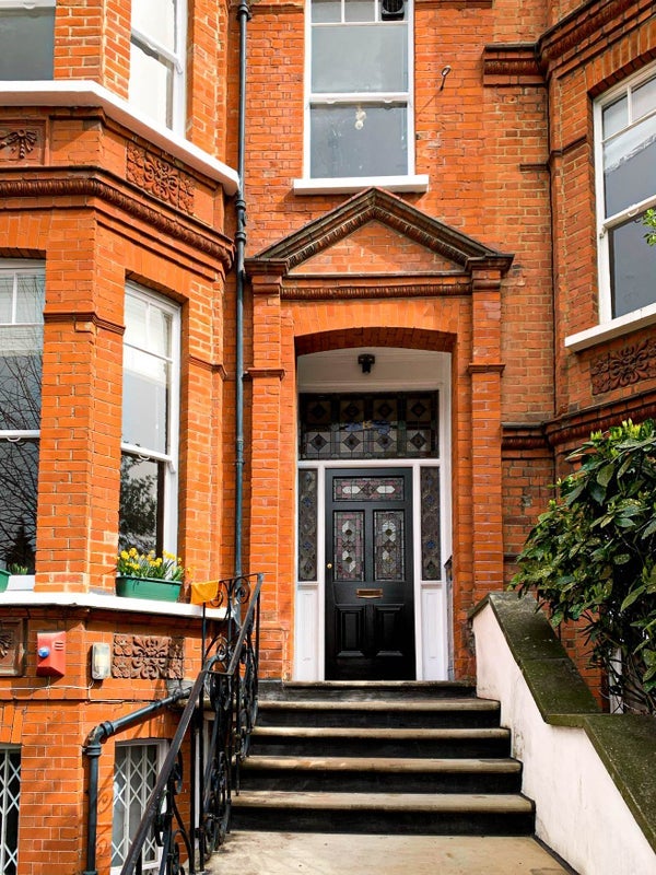 Photo 1: Front Entrance - street is full of trees