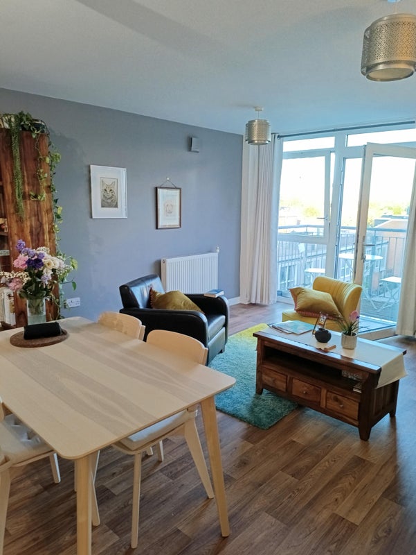 Photo 1: Living room and balcony