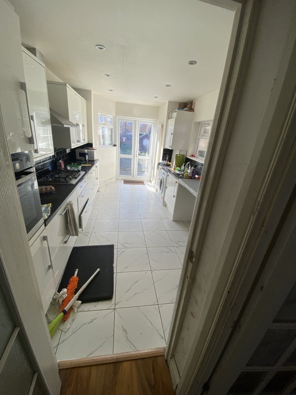 Photo 1: Shared kitchen with breakfast bar 