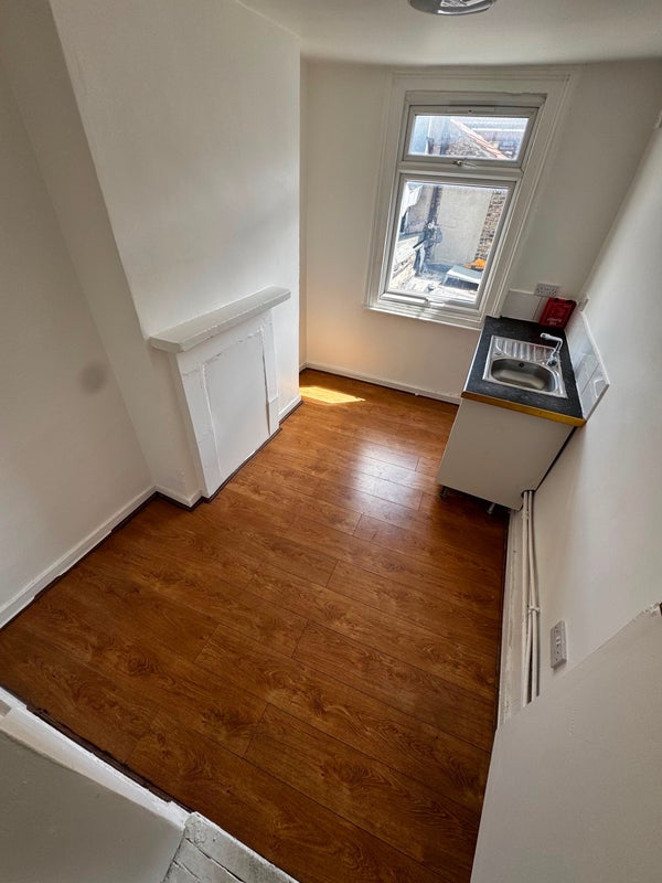 Photo 1: Room one kitchen 