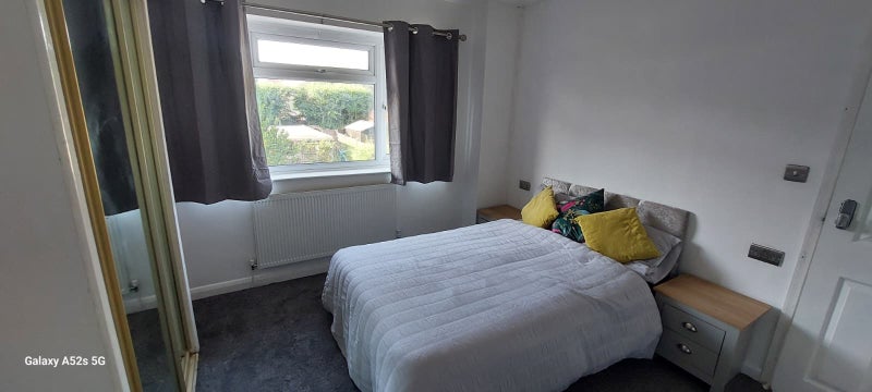 Photo 1: Furnished bedroom with TV