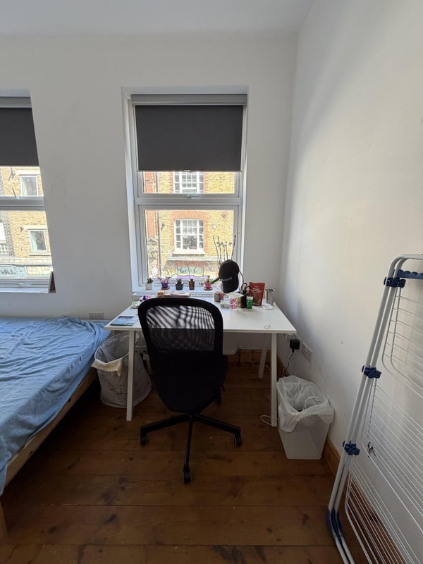 Photo 1: Wide desk with large windows
