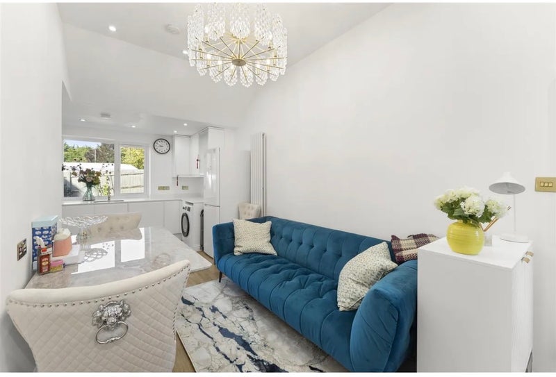 Photo 1: Living Room with Dining Table 