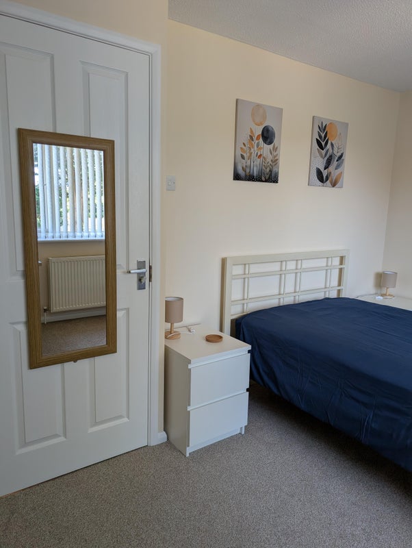 Photo 1: Small double bed. Two small chest of drawers. Electric sockets. 