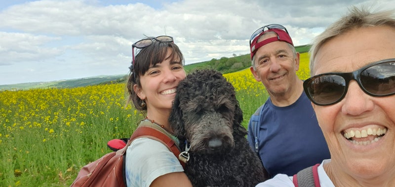 Photo 1: My parents and I on a lovely walk with my beautiful goldendoodle, Ghlo.