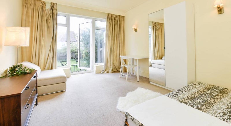 Photo 1: Ground floor bedroom with private garden access