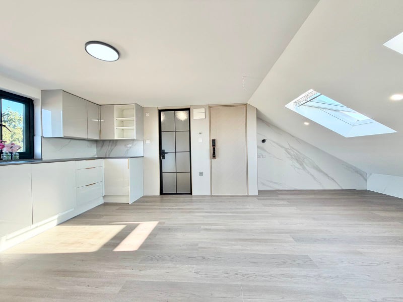 Photo 1: Bright living space with a private kitchenette and skylights.
