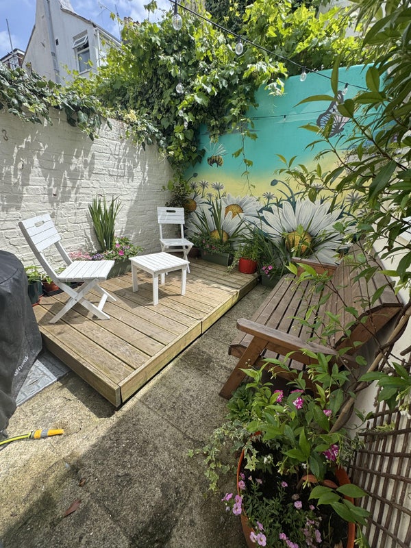 Photo 1: Sunny garden at back of house