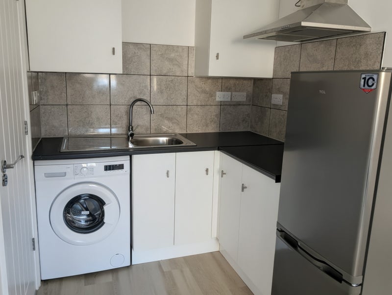 Photo 1: Kitchenette