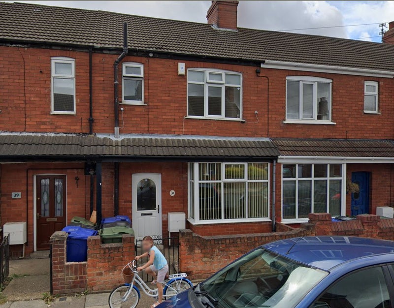 Photo 1: Exterior front