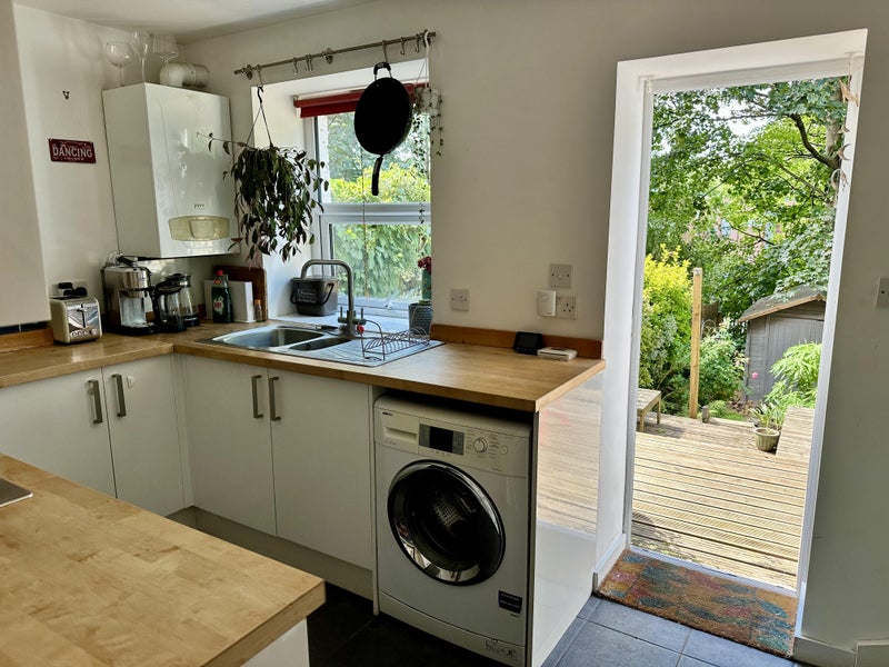 Photo 1: Kitchen opening into the garden.