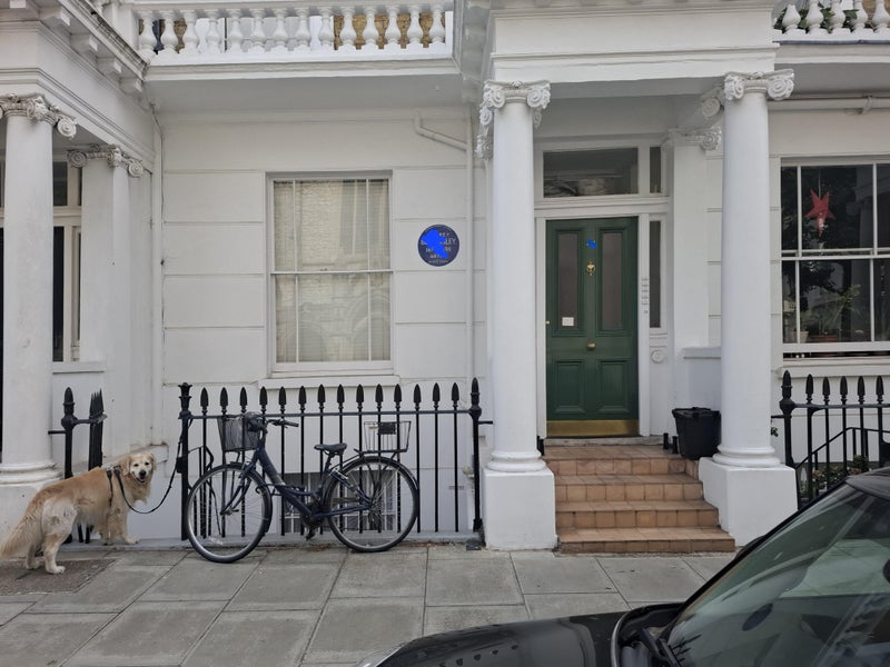 Photo 1: Front of property, entry via green door