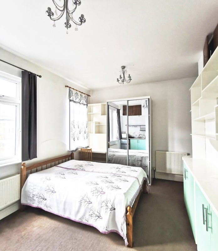 Photo 1: bed, desk, shelving