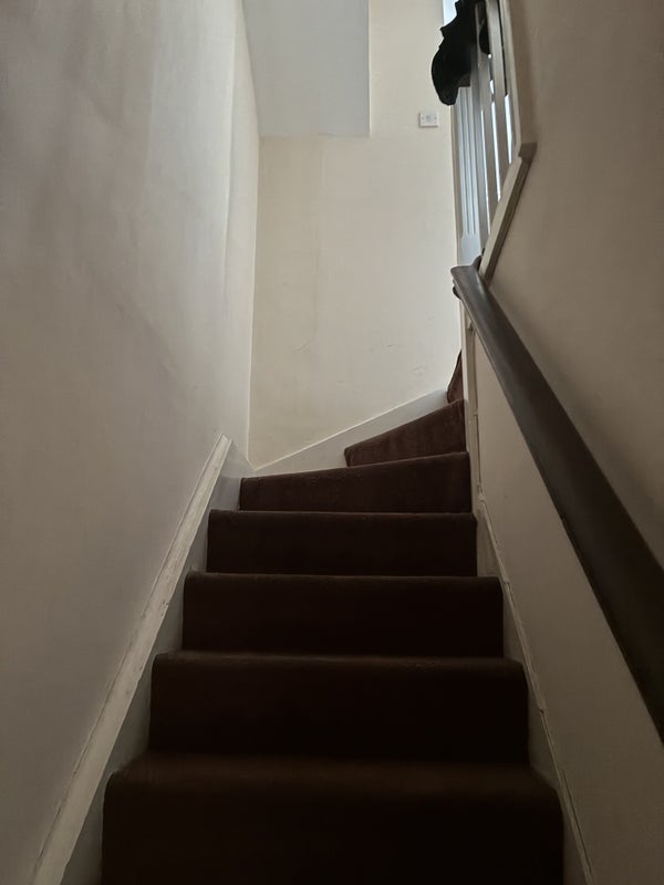 Photo 1: Stairs to top floor
