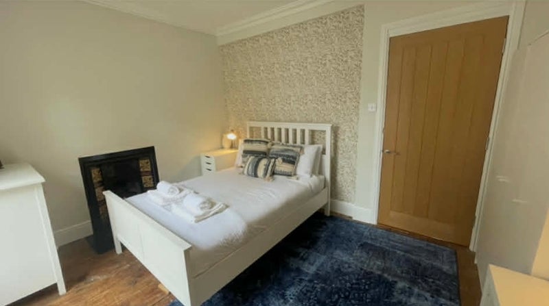 Photo 1: Bedroom including; bed, chest of drawers, bedside table, wardrobe and large desk.