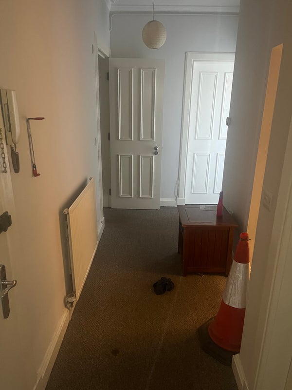 Photo 1: Main Hall (Main door on the left, bathroom 1 on the right, Toilet Facilities on the left)