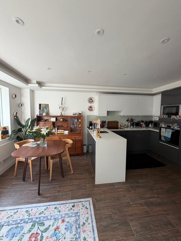 Photo 1: Kitchen area and smaller table