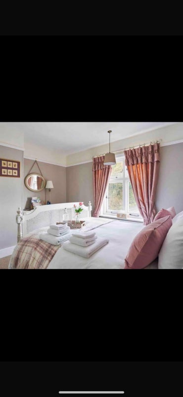 Photo 1: Beautifully decorated large bedroom with kingsize bed.