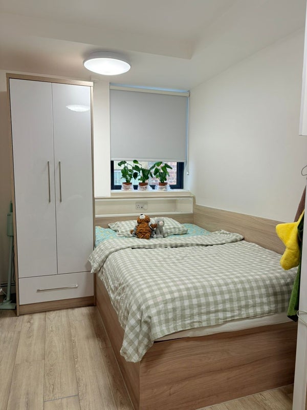 Photo 1: Semi-double bed with under-bed storage and wardrobe. 