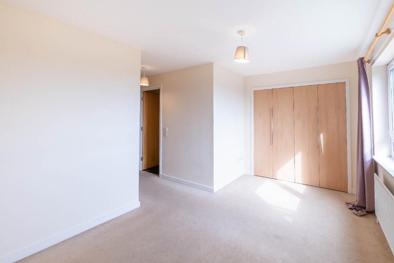 Photo 1: Large bedroom with closet.