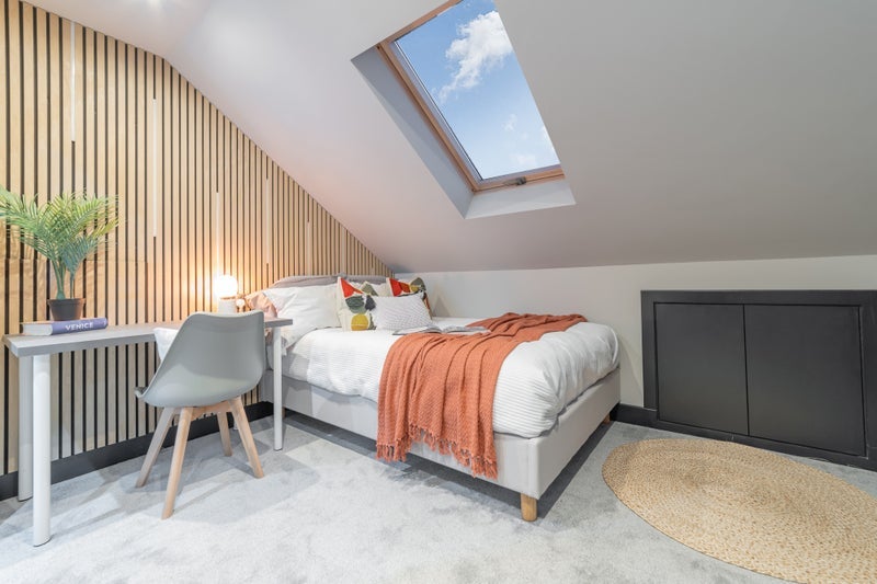 Photo 1: Room 5 – Stylish sloped ensuite with skylight, plenty of storage space (including room for luggage