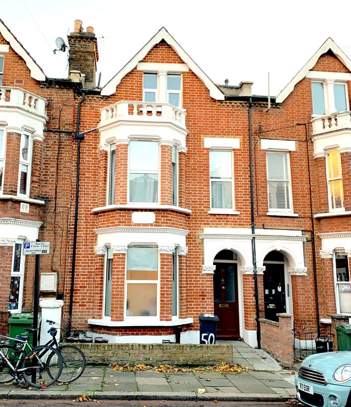 Photo 1: Front of the house (lovely red brick building)