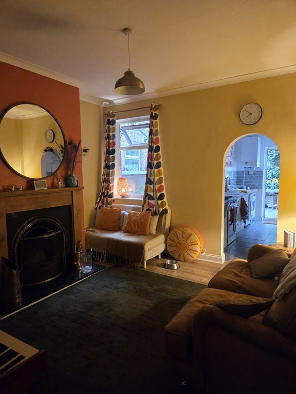 Photo 1: Cosy living room with log fire