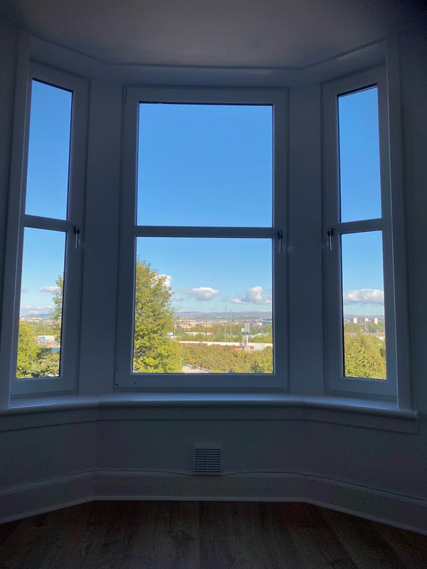 Photo 1: View of Glasgow from living room